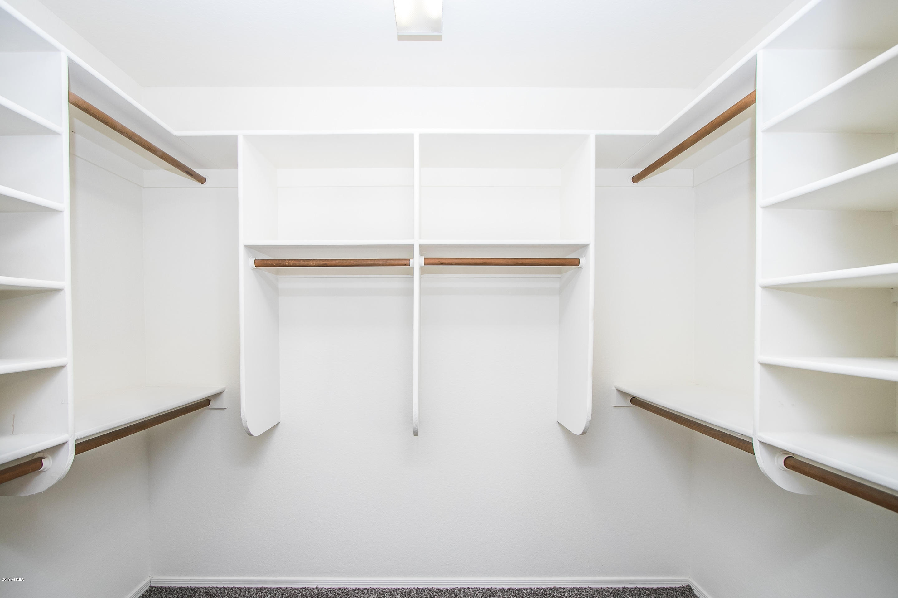 3948 East Stanford Avenue Gilbert, AZ 85234 - Photo 23 of 32 a view of an empty walk in closet