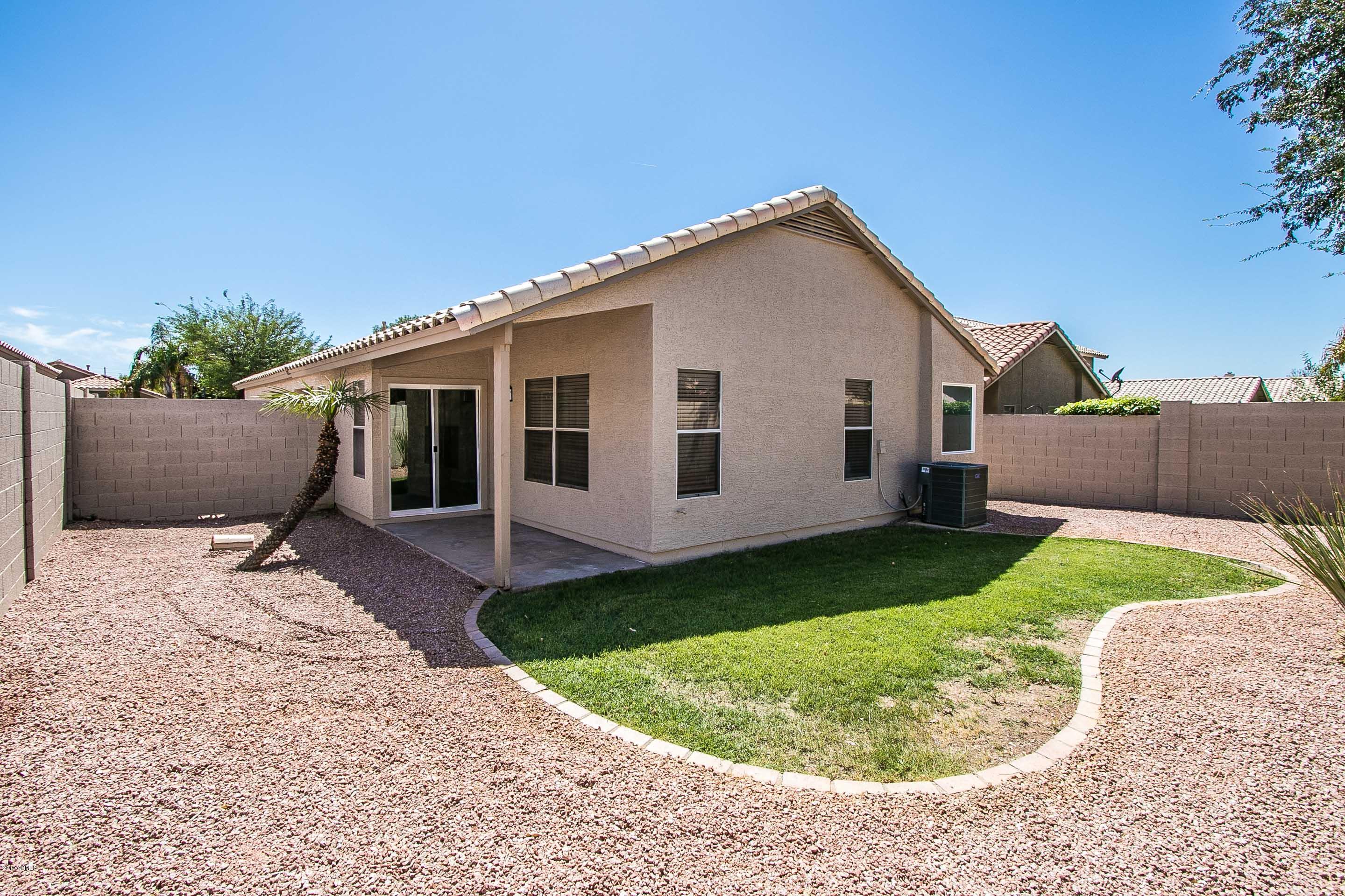 3948 East Stanford Avenue Gilbert, AZ 85234 - Photo 30 of 32 a view of a house with a yard