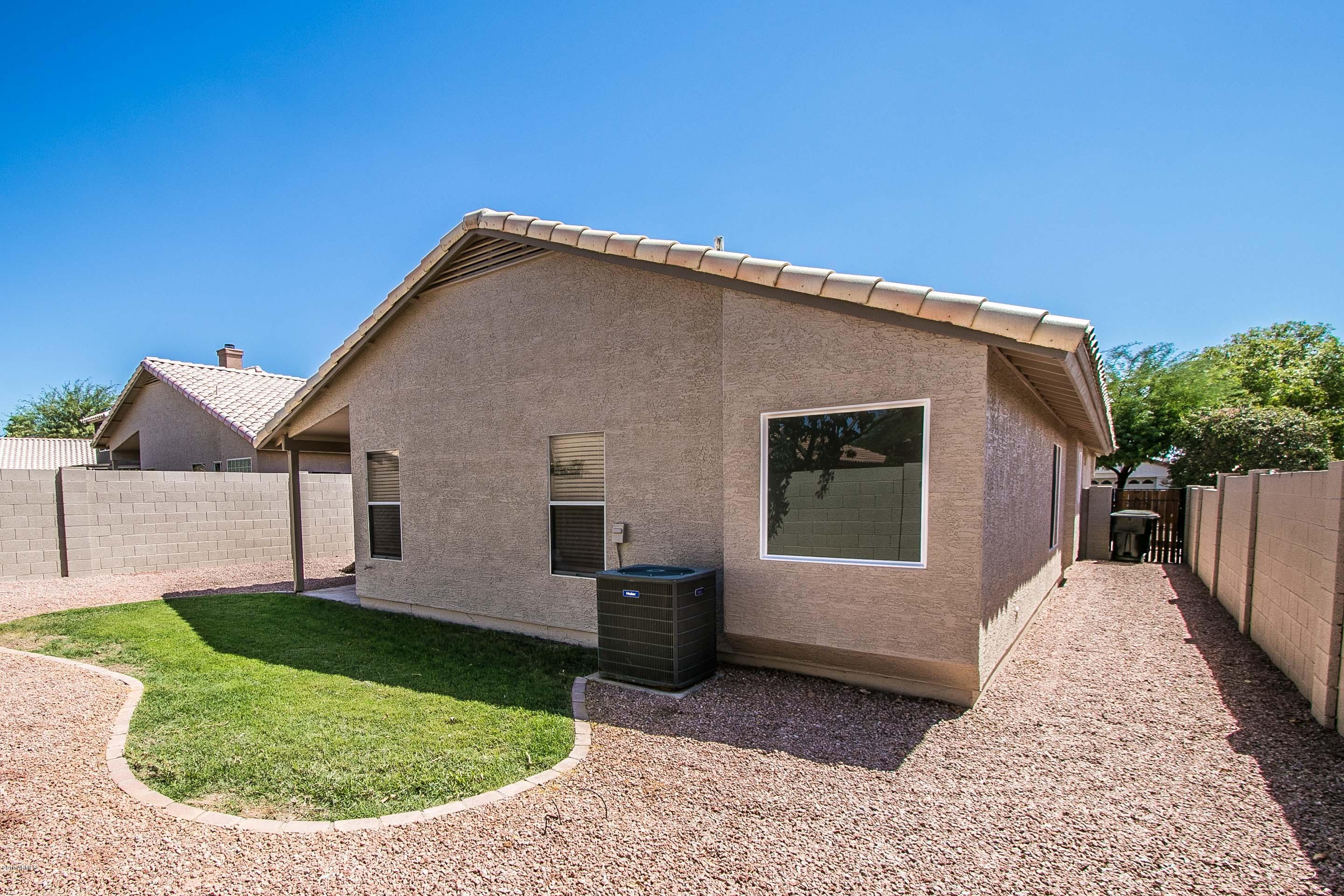3948 East Stanford Avenue Gilbert, AZ 85234 - Photo 32 of 32 a view of a house with a yard