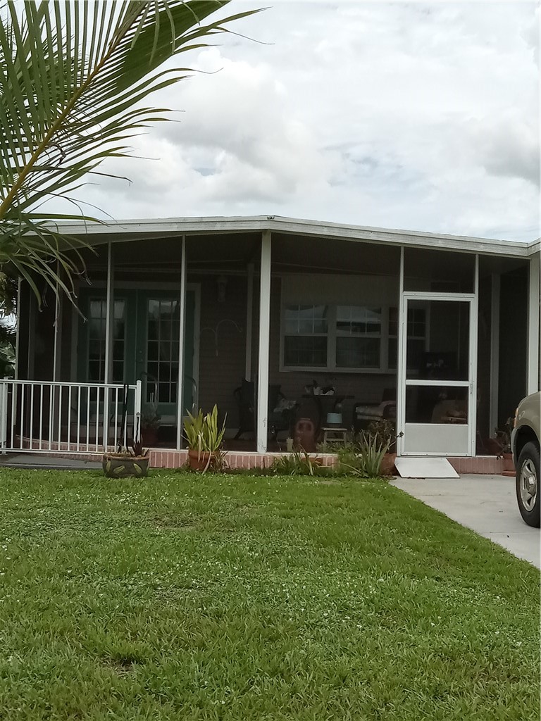 740 Lark Drive Sebastian, FL 32976 - Photo 1 of 11 a view of a house with yard and porch