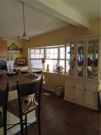 a kitchen with sink and cabinets