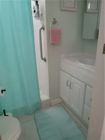 a bathroom with a sink and toilet
