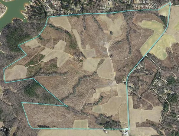a aerial view of a house with a yard
