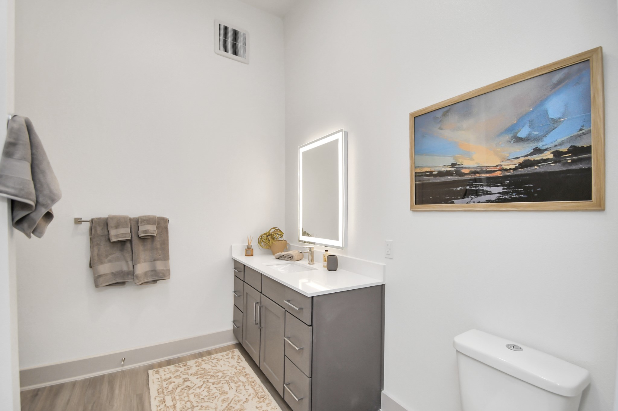 1617 Enid Street, Unit 177 Houston, TX 77009 - Photo 19 of 50 a bathroom with a sink mirror and toilet