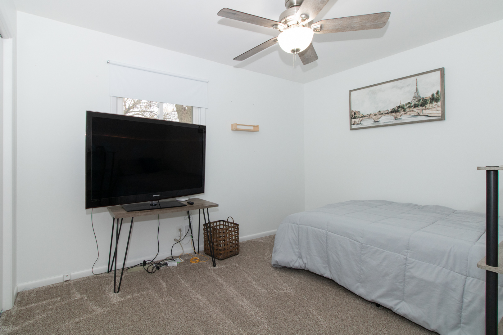 1501 Searle Drive Normal, IL 61761 - Photo 15 of 31 a room with ceiling fan and flat screen tv