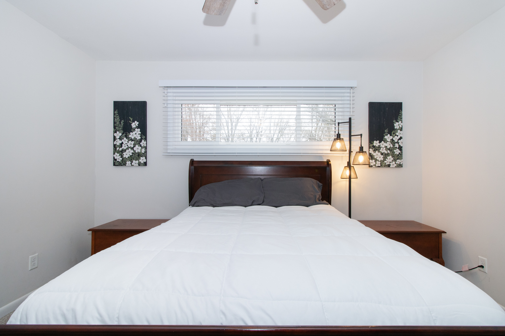 1501 Searle Drive Normal, IL 61761 - Photo 19 of 31 a large bed sitting in a bedroom next to a window with wooden floor