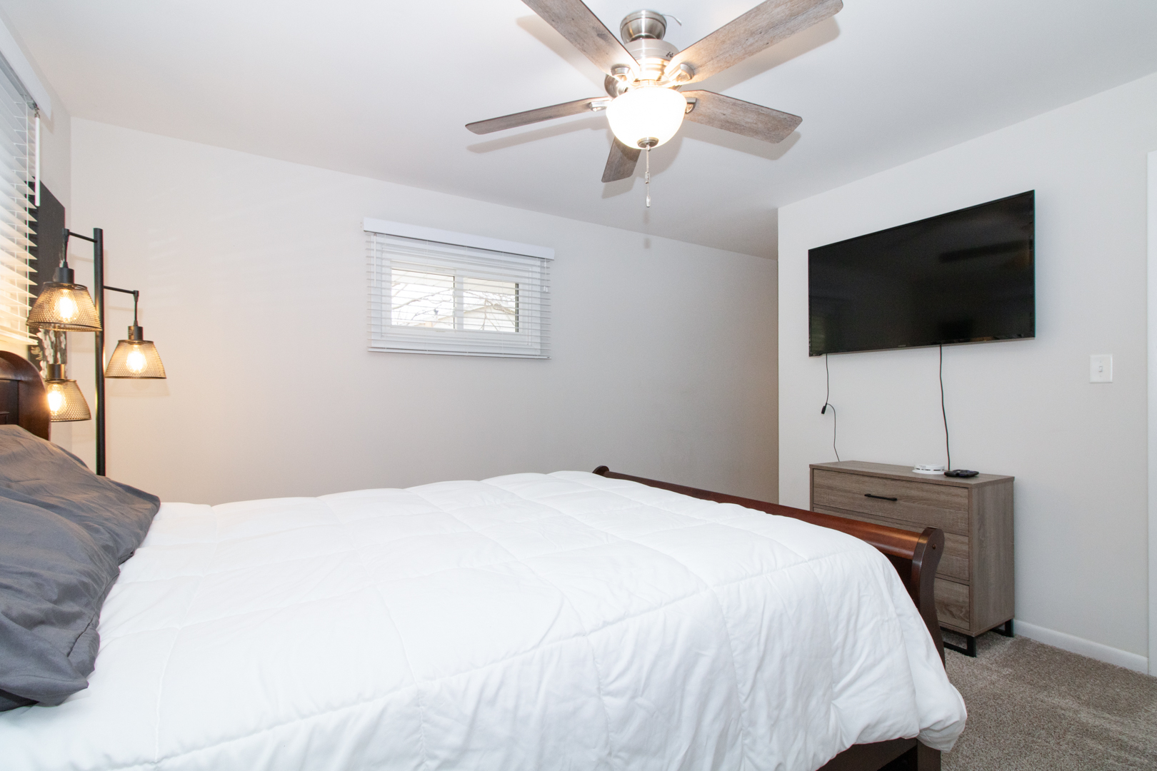 1501 Searle Drive Normal, IL 61761 - Photo 21 of 31 a bedroom with a bed and a flat screen tv