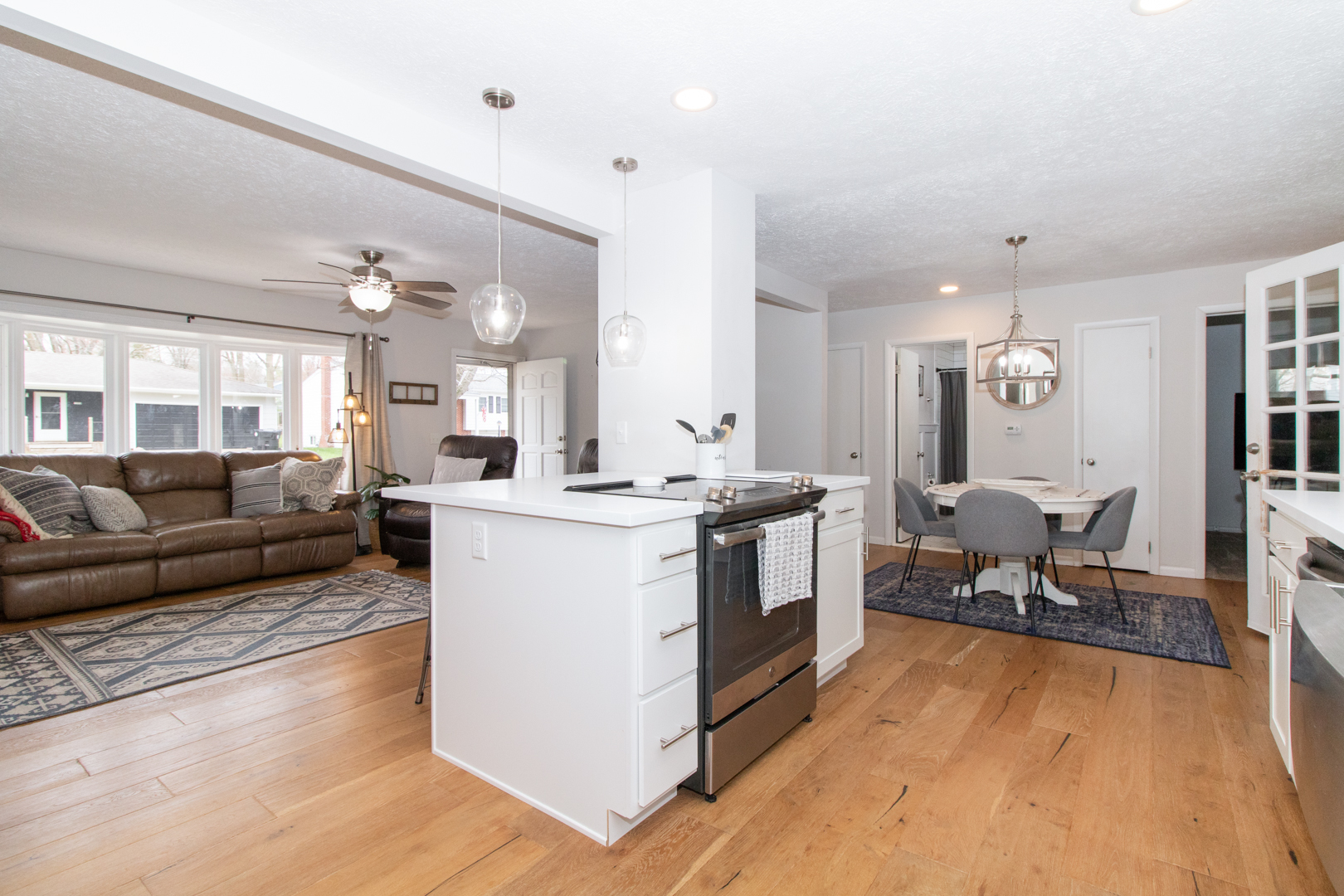 1501 Searle Drive Normal, IL 61761 - Photo 3 of 31 a living room with furniture and a dining table with kitchen view