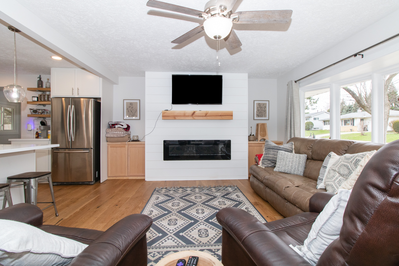 1501 Searle Drive Normal, IL 61761 - Photo 7 of 31 a living room with furniture a flat screen tv and a fireplace