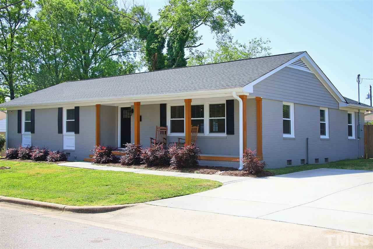 1308 East Lane Street Raleigh, NC 27610 - Photo 1 of 21 a front view of a house with a yard and porch
