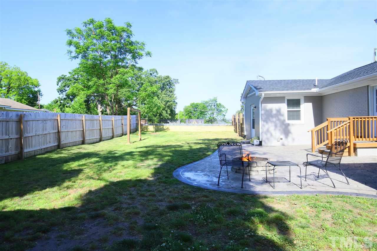 1308 East Lane Street Raleigh, NC 27610 - Photo 2 of 21 a view of a patio with a table and chairs
