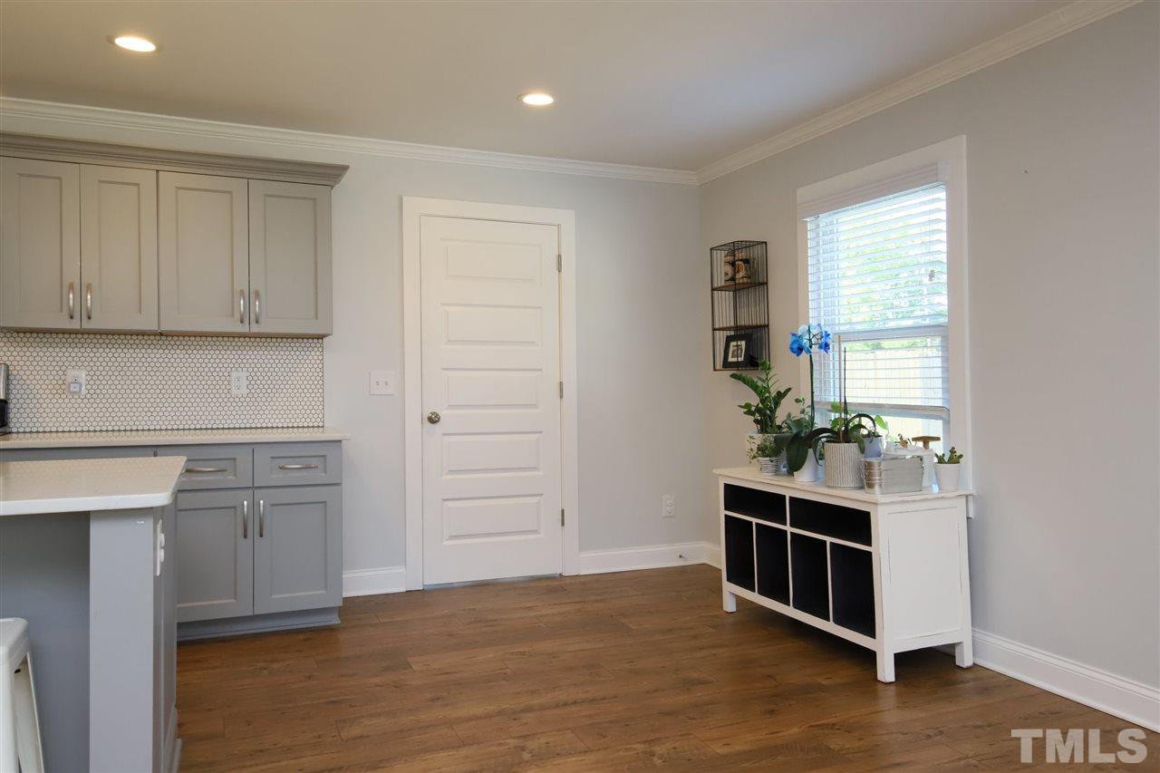 1308 East Lane Street Raleigh, NC 27610 - Photo 11 of 21 a view of kitchen with wooden floor and electronic appliances