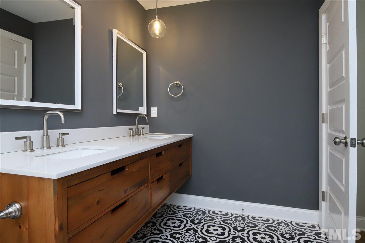 1308 East Lane Street Raleigh, NC 27610 - Photo 17 of 21 a bathroom with a sink and a mirror