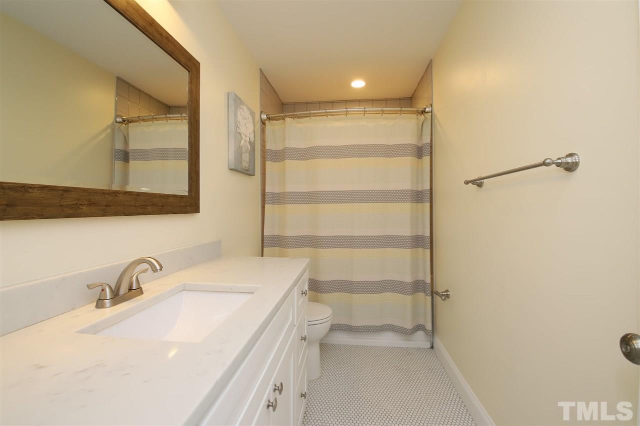 1308 East Lane Street Raleigh, NC 27610 - Photo 18 of 21 a bathroom with a sink and a mirror