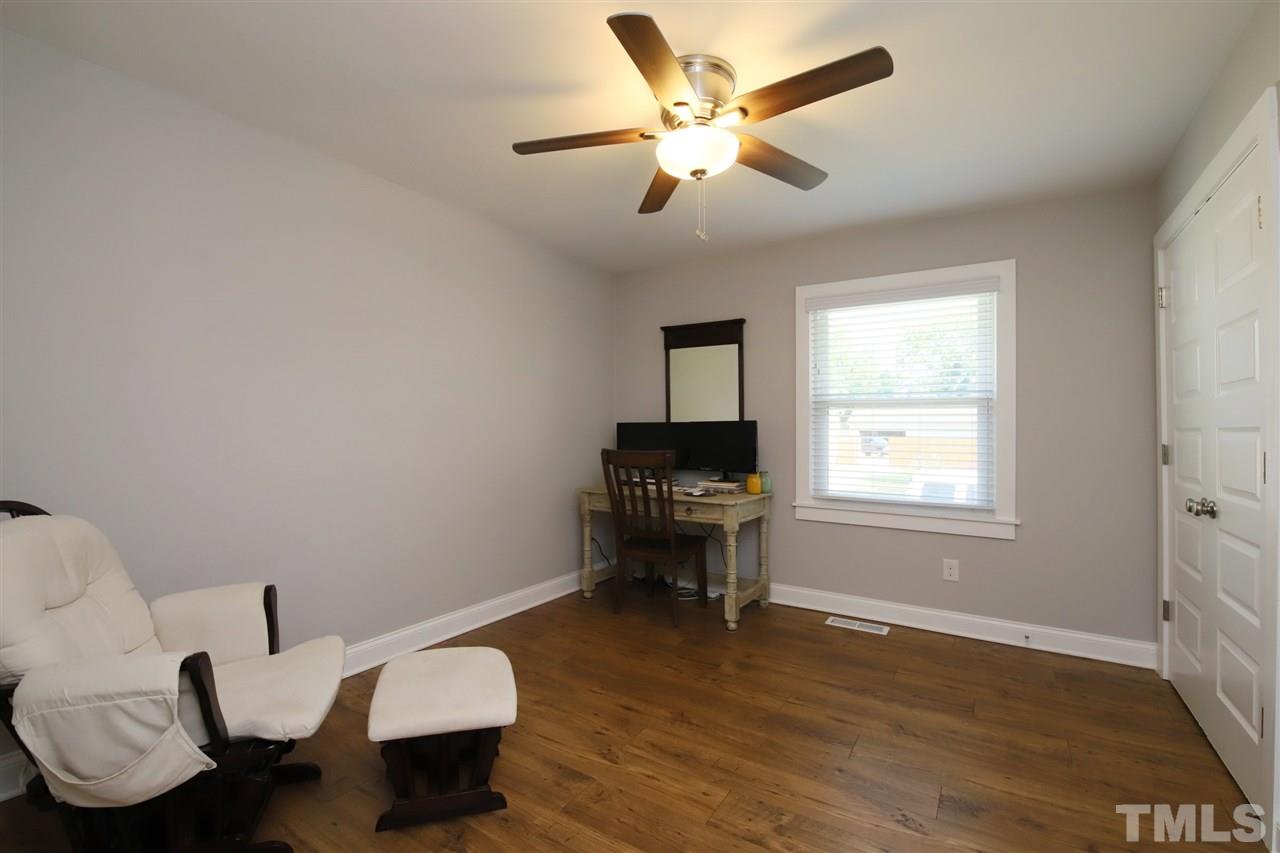1308 East Lane Street Raleigh, NC 27610 - Photo 20 of 21 a living room with furniture and a window