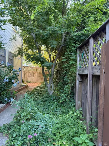 a backyard of a house with lots of green space