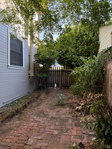 a kitchen with stainless steel appliances granite countertop a sink and a stove