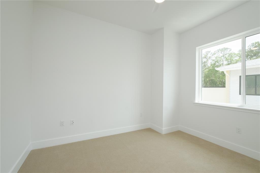 2601 Southwest Williston Road, Unit 2 Gainesville, FL 32608 - Photo 29 of 39 an empty room with a window