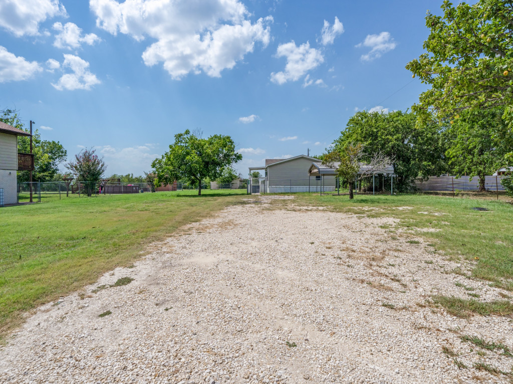 4654 Old Howard Road Temple, TX 76504 - Photo 23 of 25 A spacious lot features a private entrance and ample parking, surrounded by mature trees and verdant lawns.