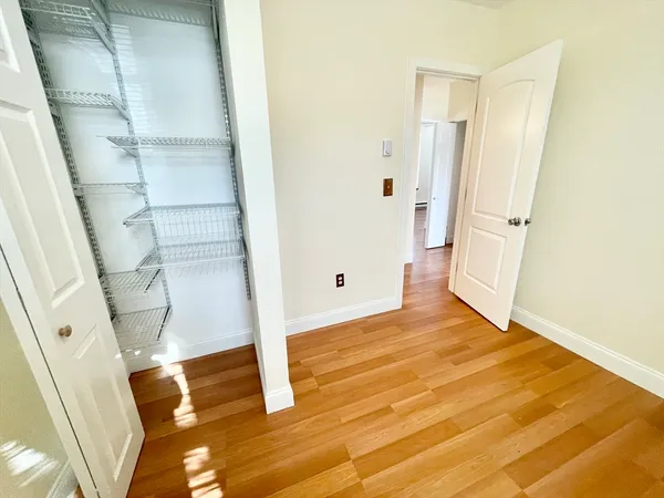 a view of entryway with wooden floor