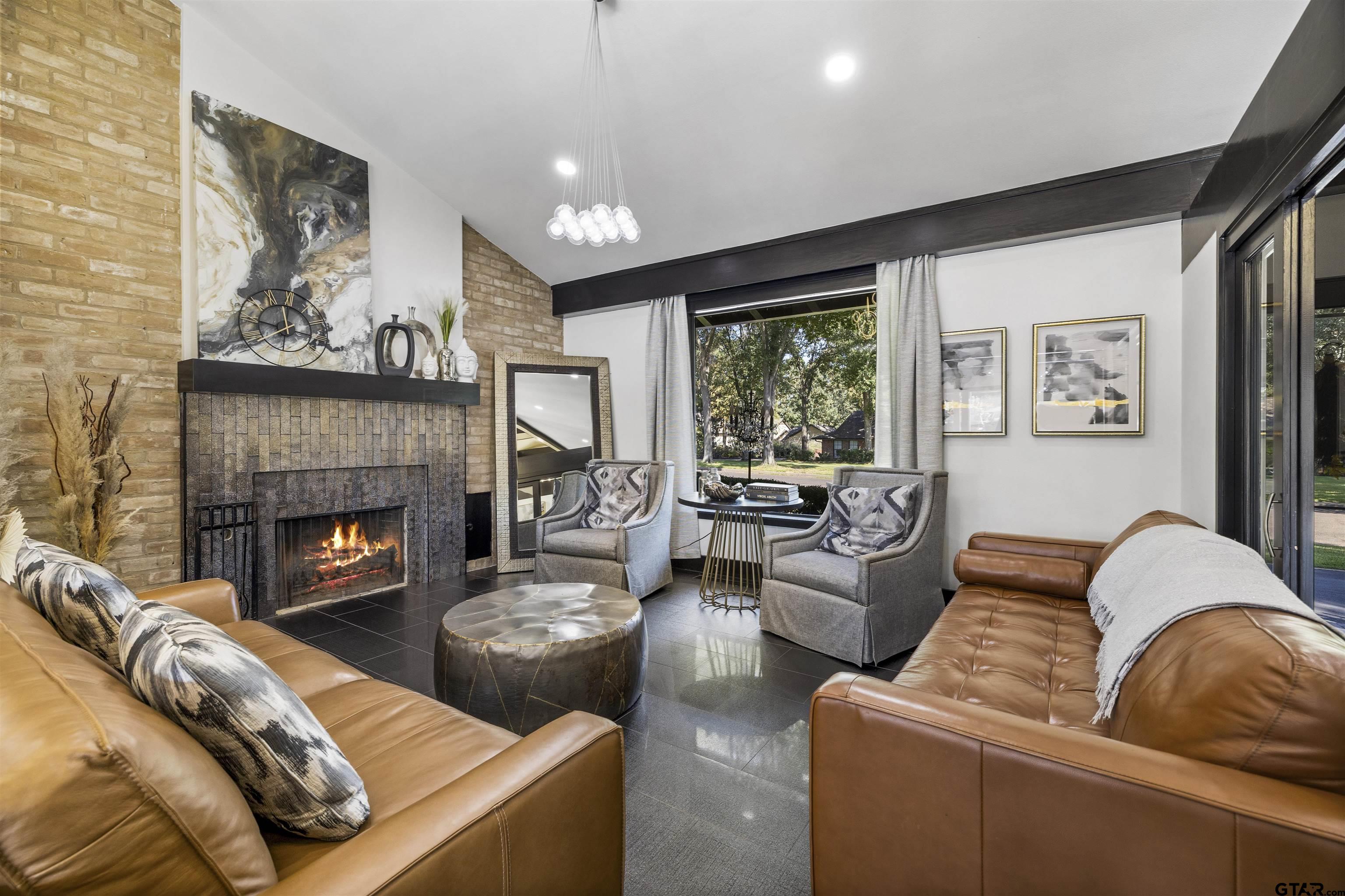 1300 Montclair Street Longview, TX 75601 - Photo 13 of 40 a living room with furniture and a fireplace