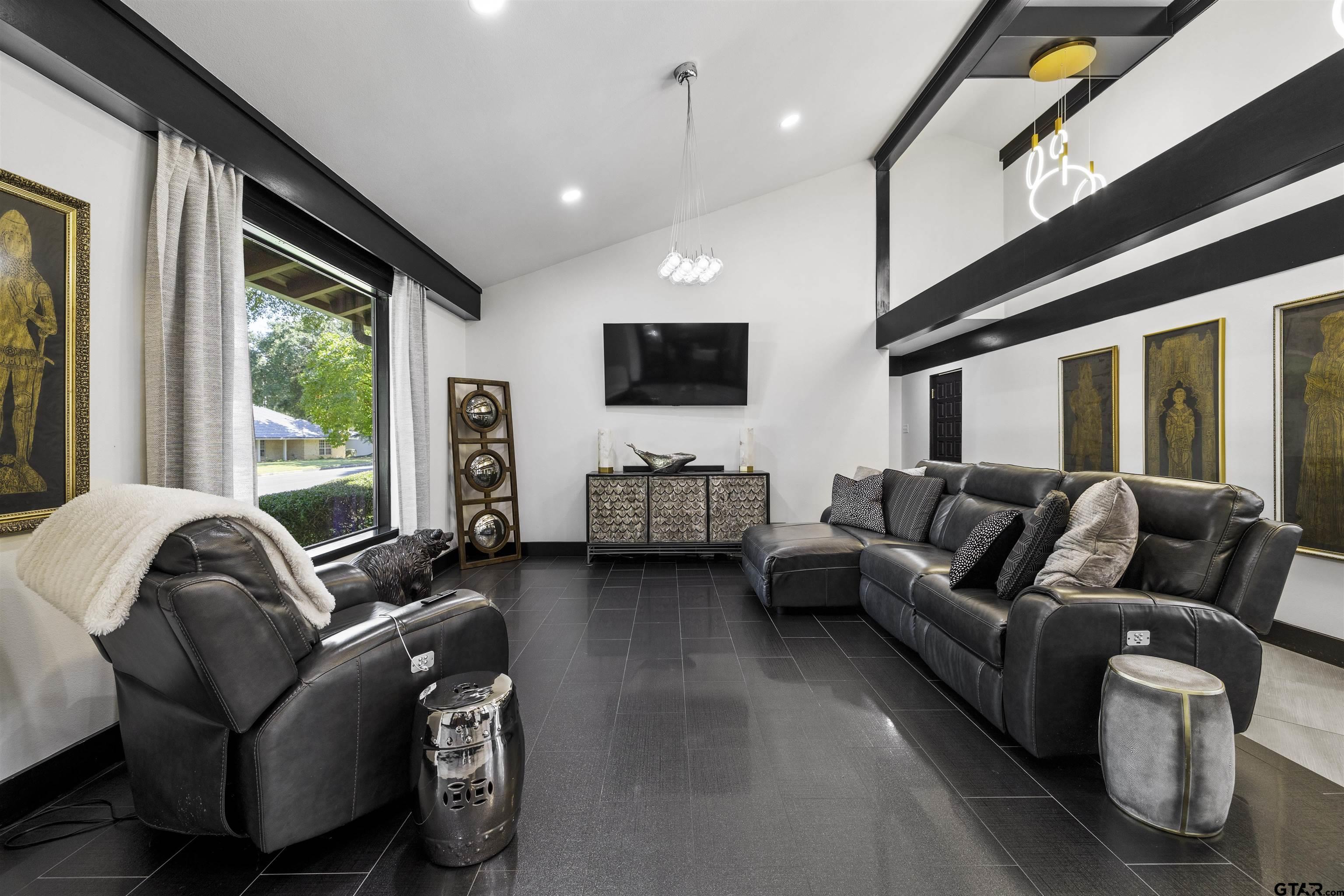 1300 Montclair Street Longview, TX 75601 - Photo 14 of 40 a living room with furniture and a flat screen tv