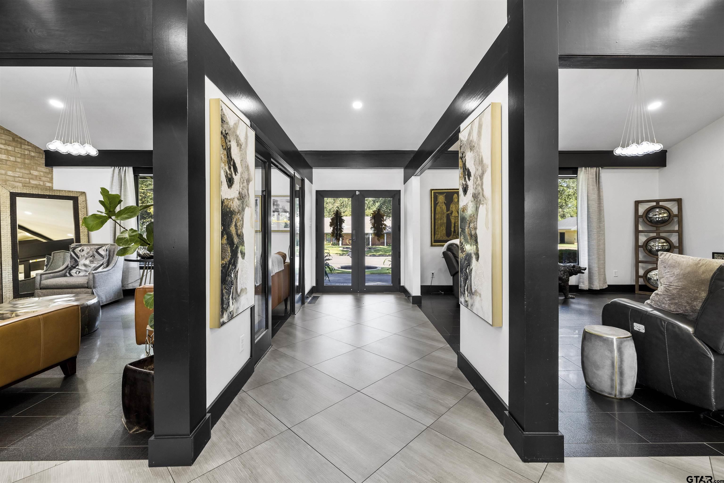 1300 Montclair Street Longview, TX 75601 - Photo 26 of 40 a view of a hallway with living room and furniture