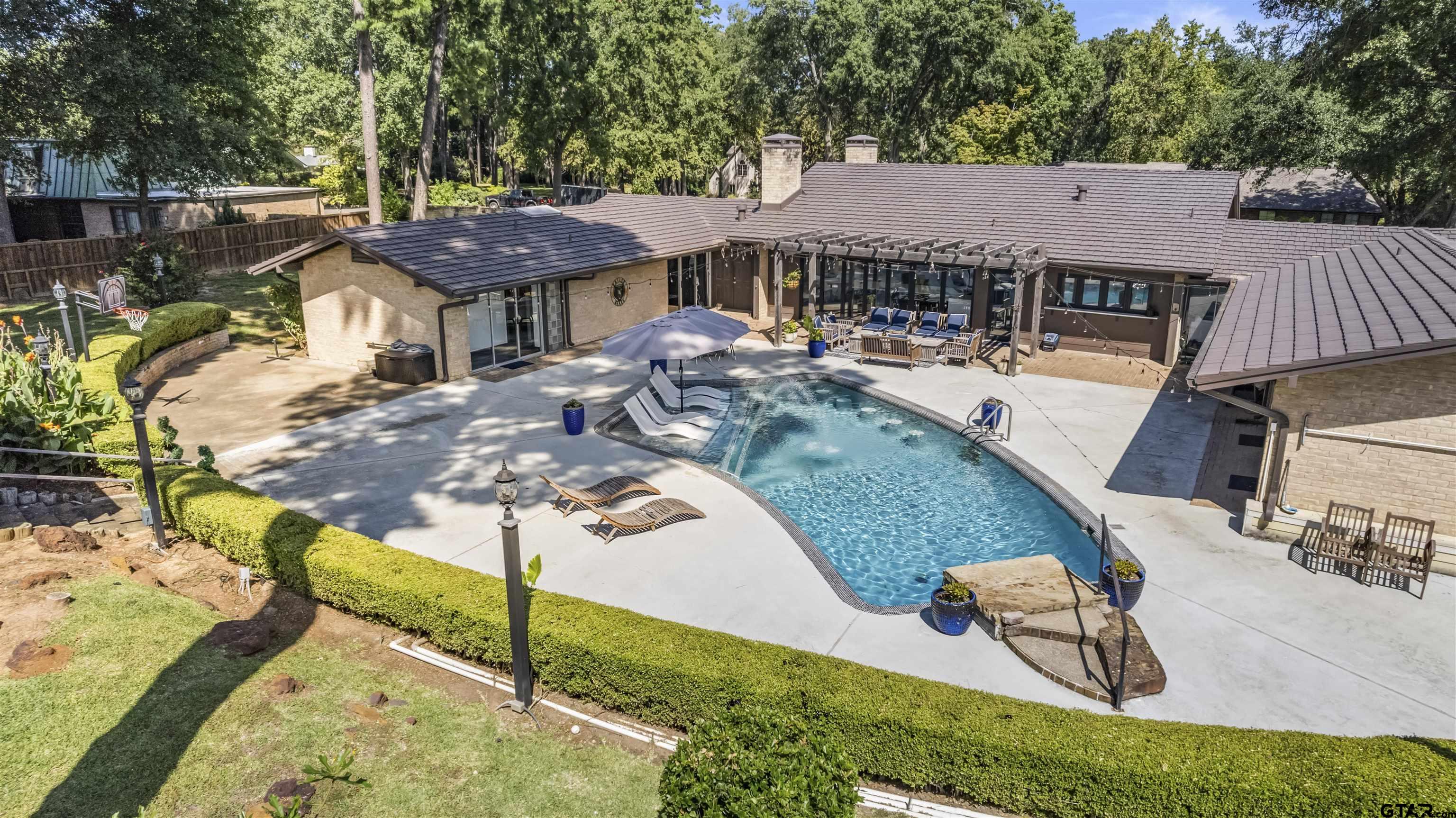 1300 Montclair Street Longview, TX 75601 - Photo 3 of 40 a view of a house with backyard and sitting area