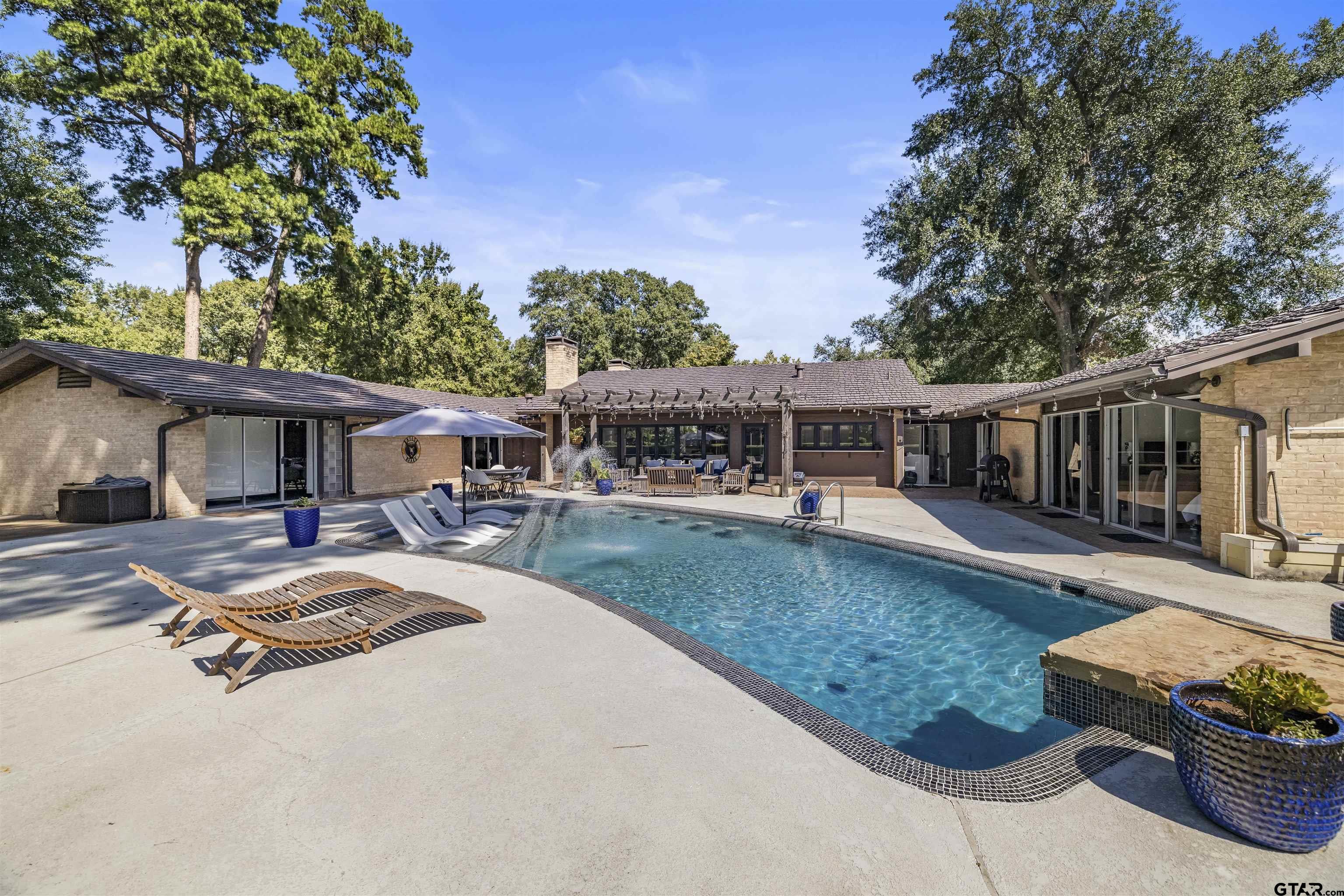 1300 Montclair Street Longview, TX 75601 - Photo 31 of 40 front view of a house with a patio