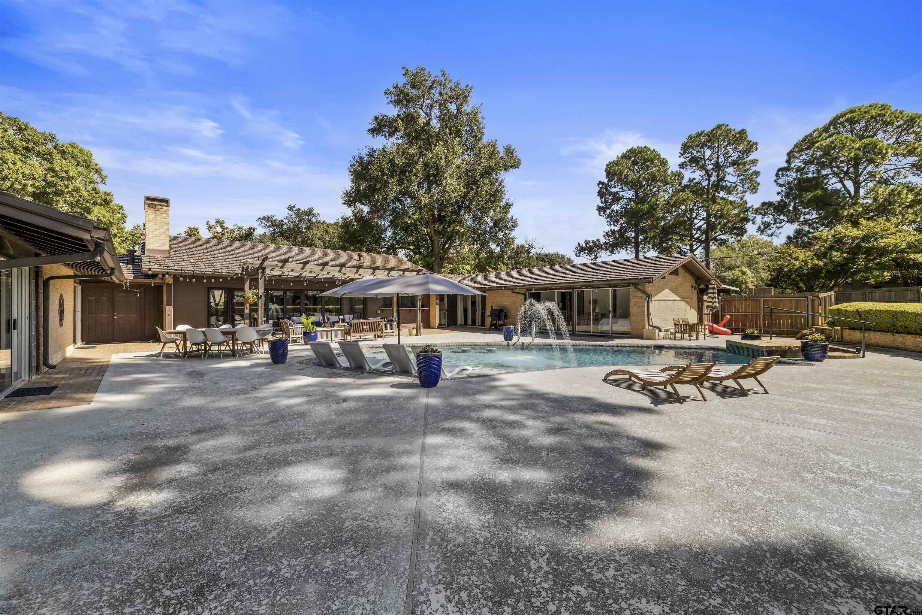 1300 Montclair Street Longview, TX 75601 - Photo 36 of 40 a view of a house with backyard space and sitting area