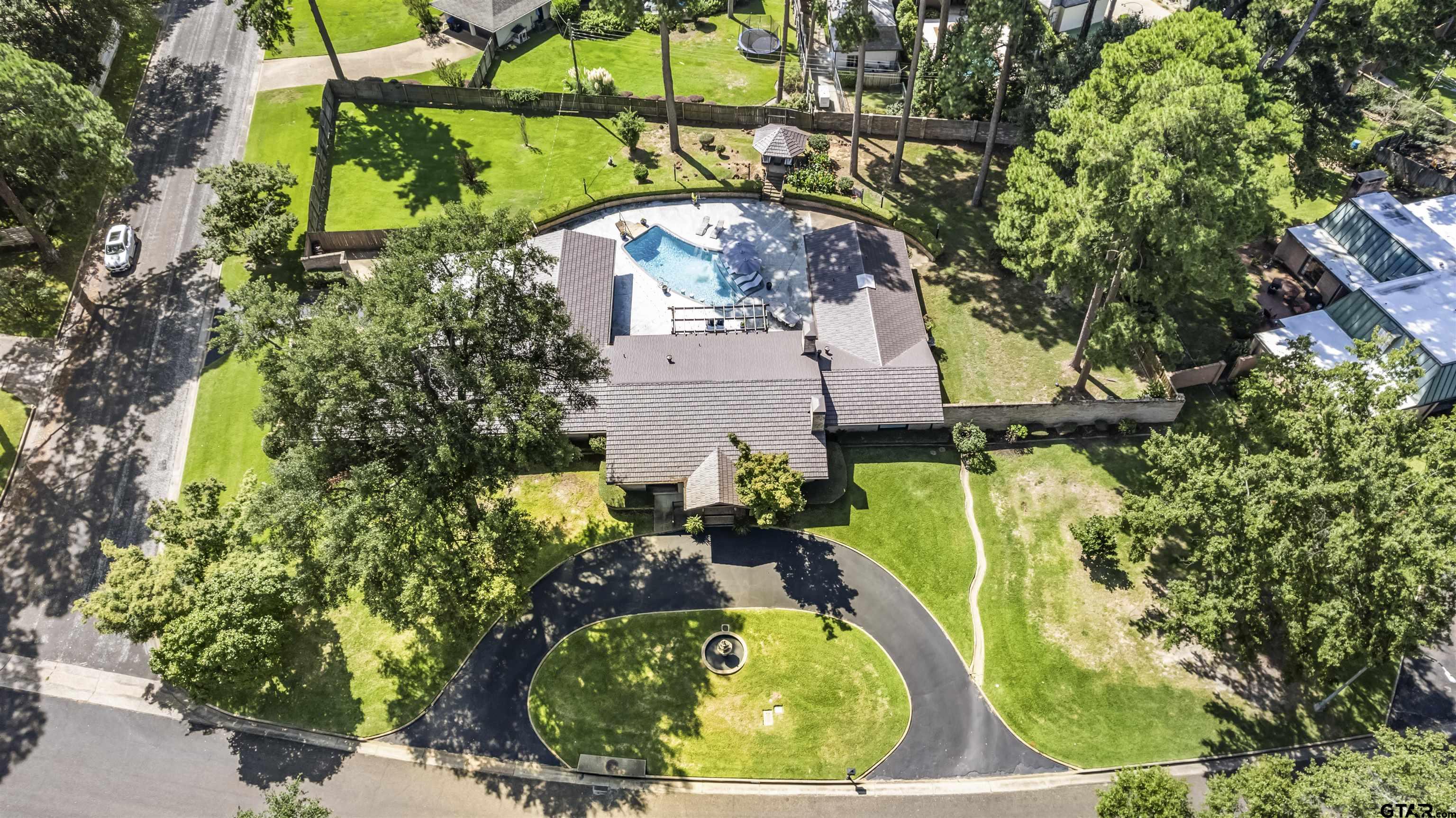 1300 Montclair Street Longview, TX 75601 - Photo 37 of 40 a picture of a tree with a yard