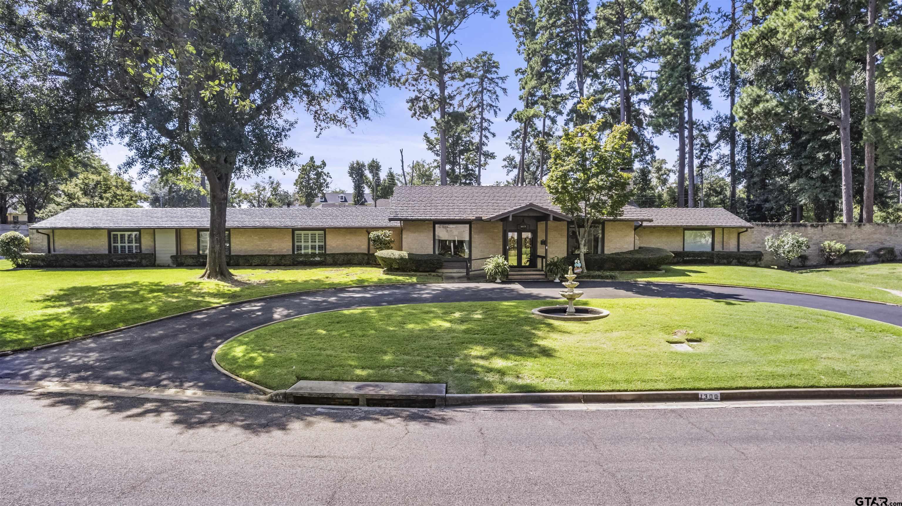 1300 Montclair Street Longview, TX 75601 - Photo 39 of 40 a view of a house with swimming pool and a yard
