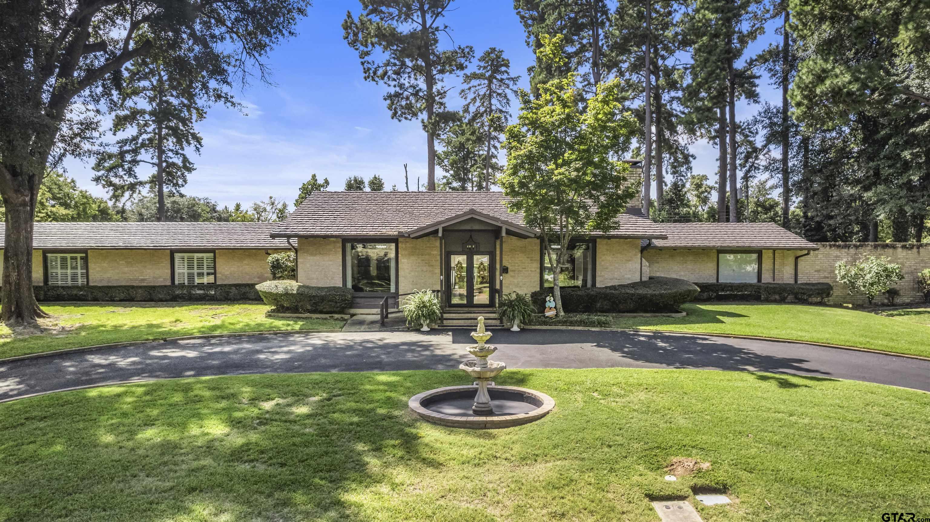 1300 Montclair Street Longview, TX 75601 - Photo 40 of 40 a front view of a house with a yard and porch