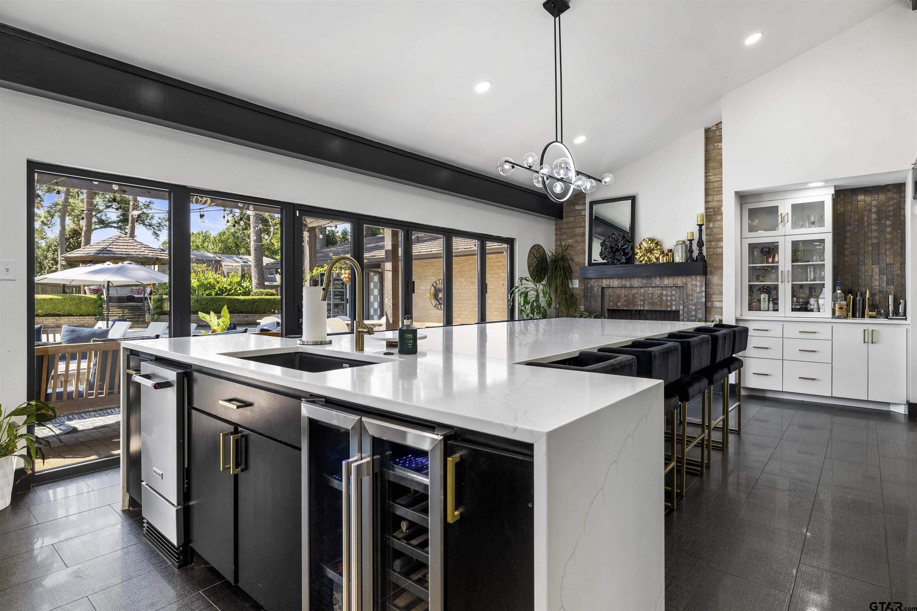 1300 Montclair Street Longview, TX 75601 - Photo 5 of 40 a kitchen with stainless steel appliances granite countertop a sink and a stove