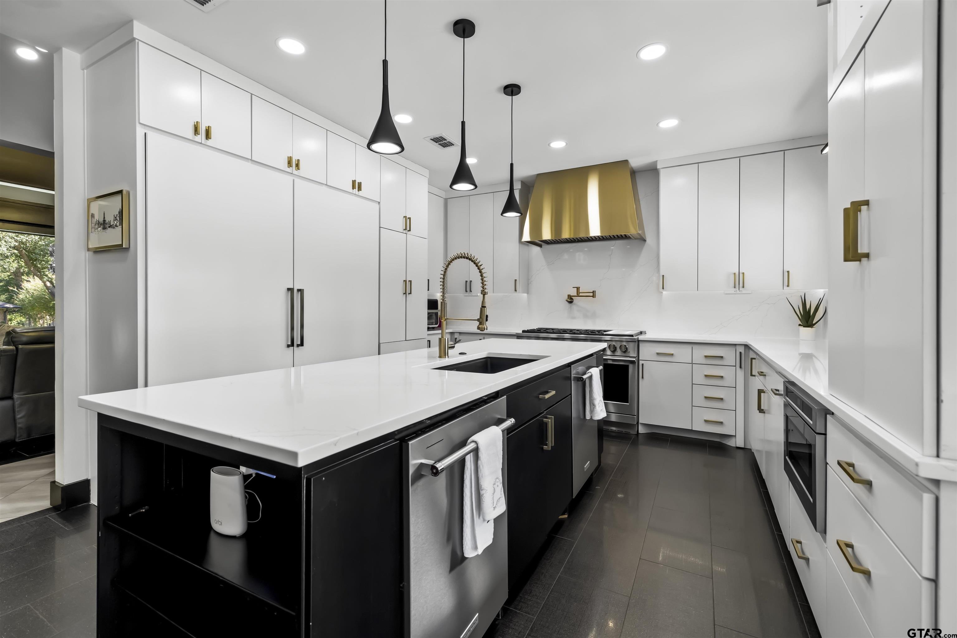 1300 Montclair Street Longview, TX 75601 - Photo 7 of 40 a kitchen with a sink stove and refrigerator