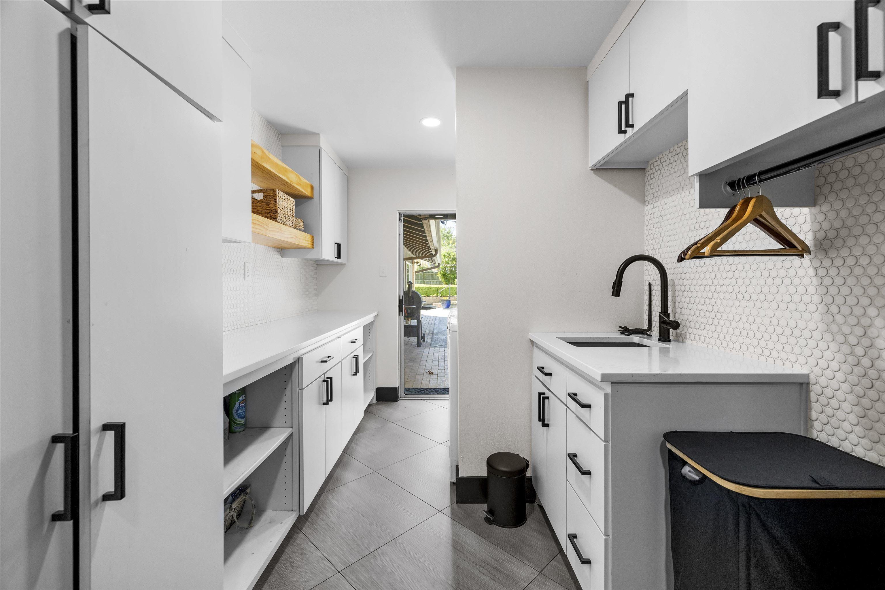 1300 Montclair Street Longview, TX 75601 - Photo 10 of 40 a kitchen with a sink cabinets and appliances