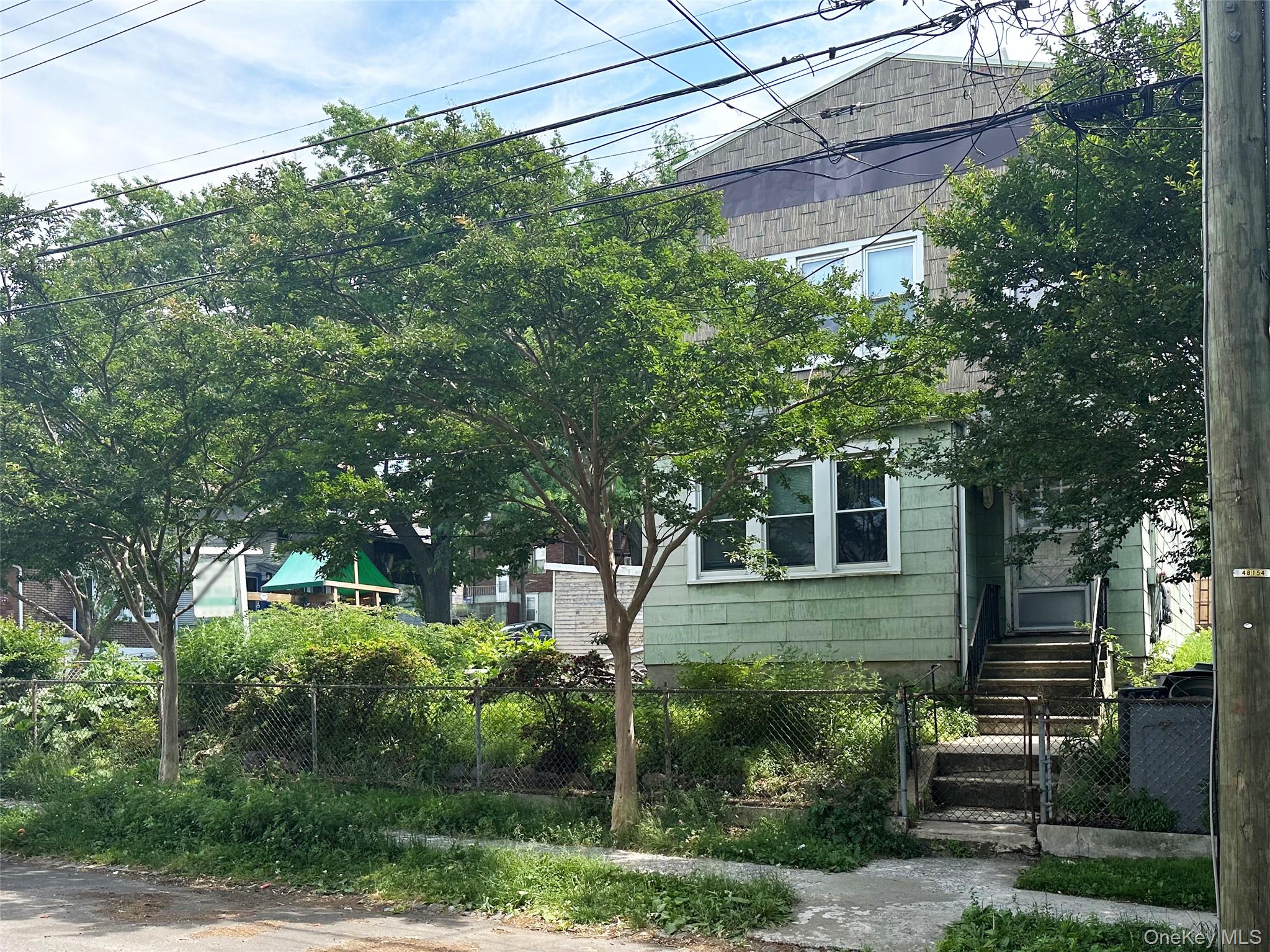 65-38 51st Road Queens, NY 11377 - Photo 2 of 6 Front of the 2-family building.