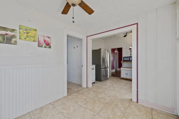 a view of an entryway with wooden floor and stairs