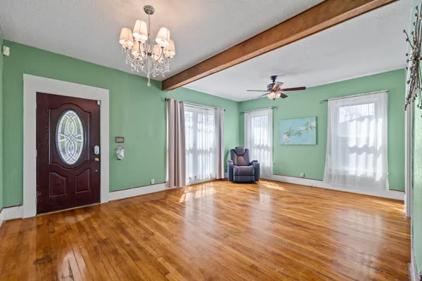 a view of a room with furniture window and wooden floor