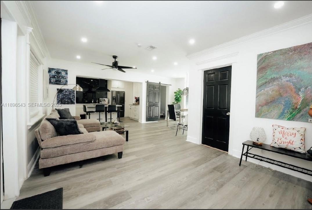 867 Northwest 4th Avenue Homestead, FL 33030 - Photo 3 of 17 a living room with furniture and a flat screen tv