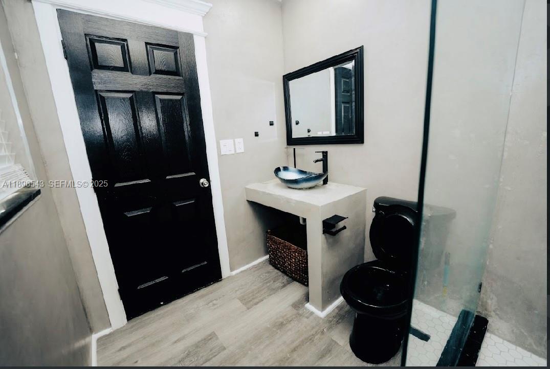 867 Northwest 4th Avenue Homestead, FL 33030 - Photo 6 of 17 a bathroom with a sink and a mirror