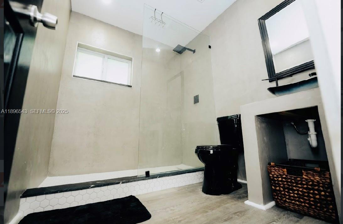 867 Northwest 4th Avenue Homestead, FL 33030 - Photo 10 of 17 a room with a walk in closet and a mirror