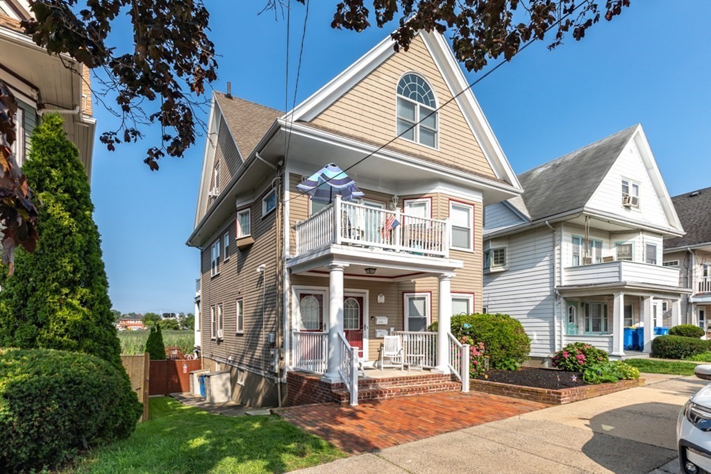 a view of a building with a yard