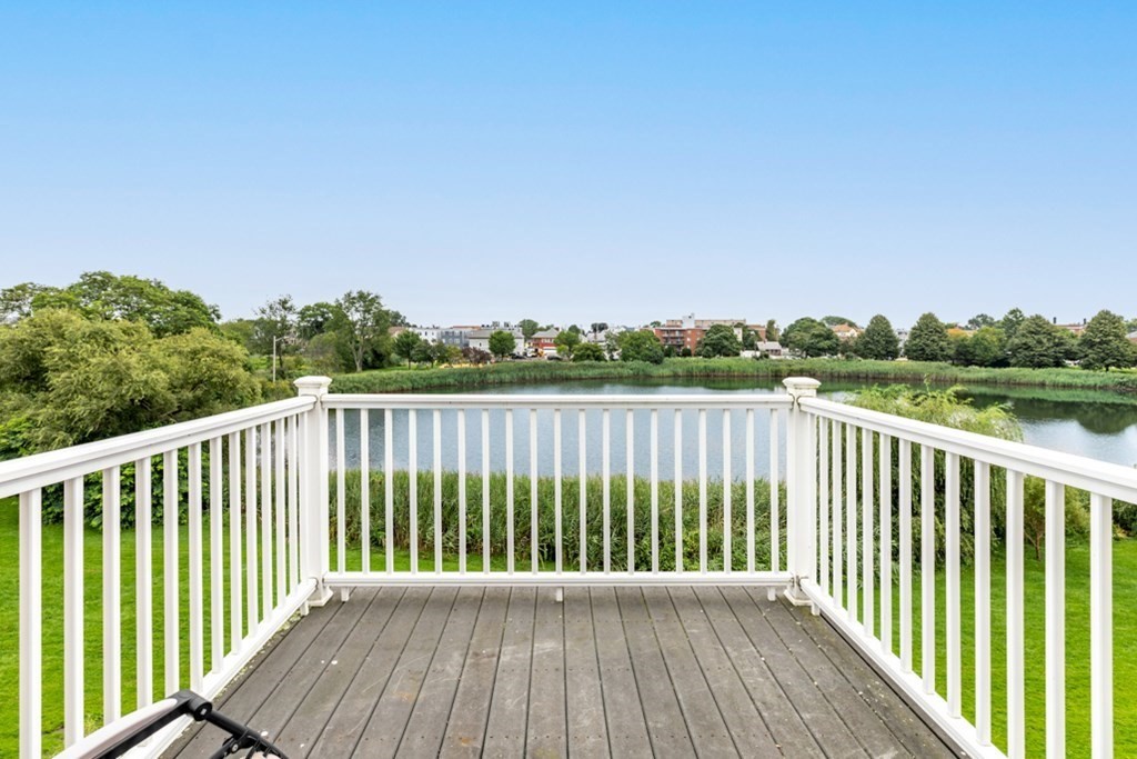 272 River Road Winthrop, MA 02152 - Photo 13 of 42 a balcony with trees in front of it
