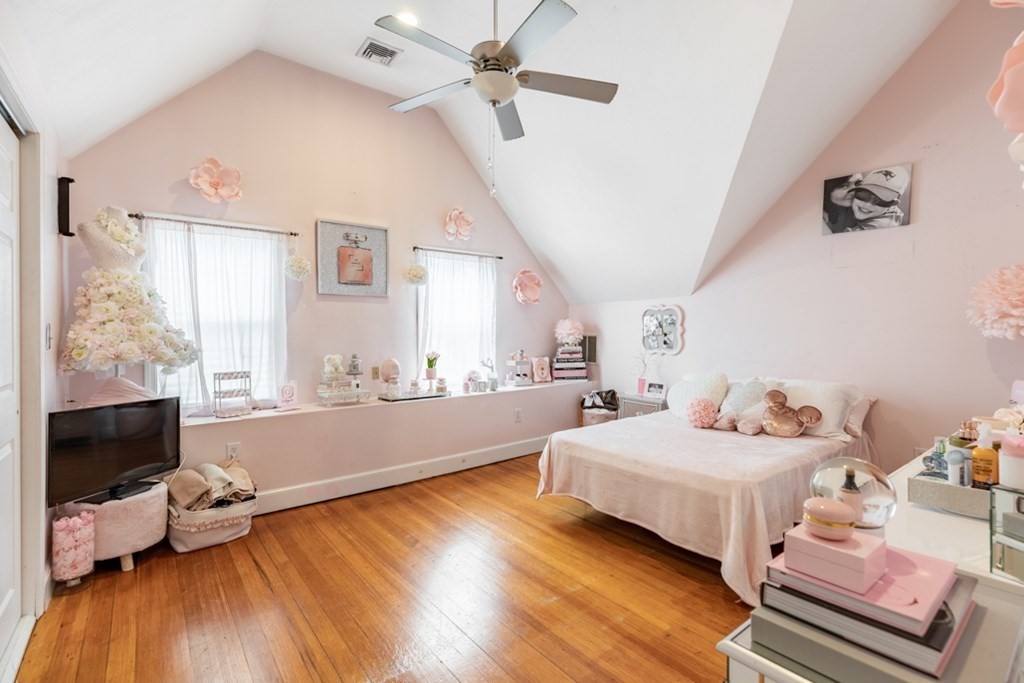 272 River Road Winthrop, MA 02152 - Photo 16 of 42 a bedroom with furniture and a window