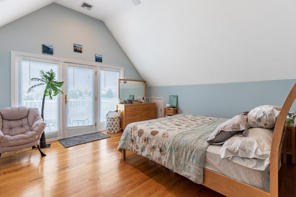 272 River Road Winthrop, MA 02152 - Photo 17 of 42 a bedroom with a bed and a potted plant