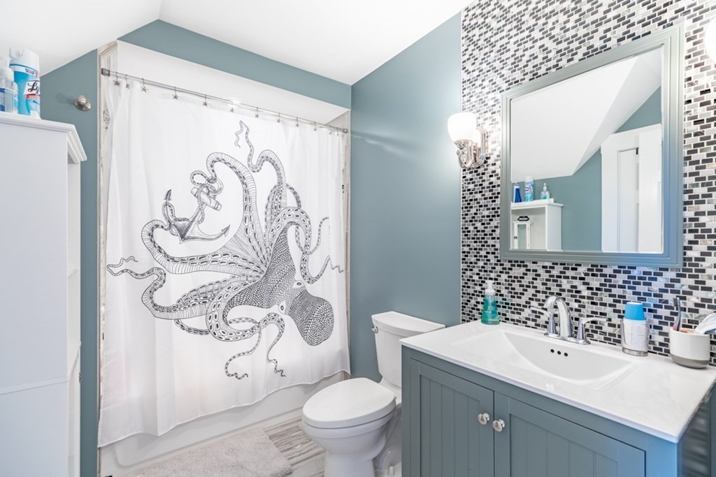 272 River Road Winthrop, MA 02152 - Photo 18 of 42 a bathroom with a sink and mirror with toilet