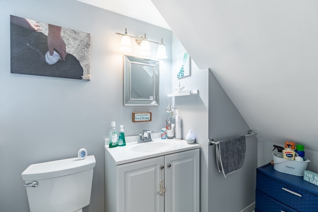 272 River Road Winthrop, MA 02152 - Photo 20 of 42 a bathroom with a sink vanity mirror and toilet
