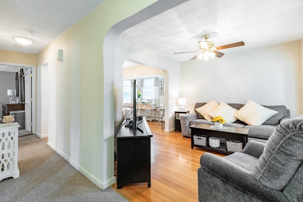 272 River Road Winthrop, MA 02152 - Photo 21 of 42 a living room with furniture a rug and a chandelier