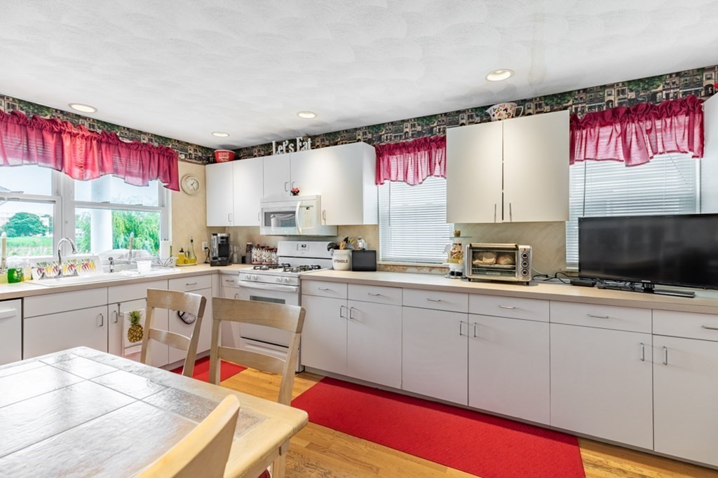 272 River Road Winthrop, MA 02152 - Photo 27 of 42 a kitchen with appliances a sink and cabinets